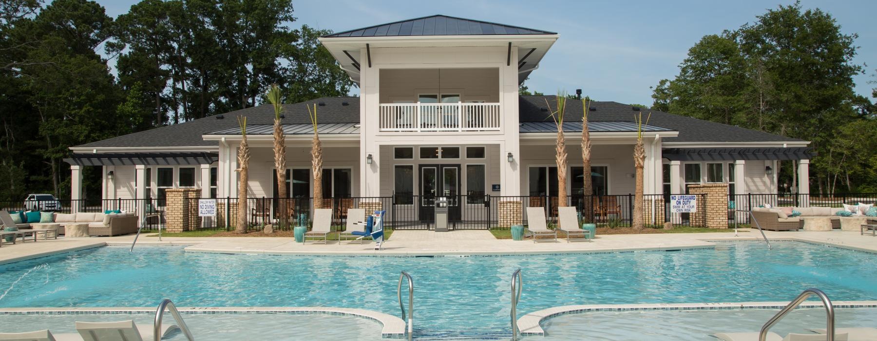 a swimming pool in front of a house