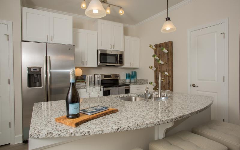 a kitchen with white cabinets