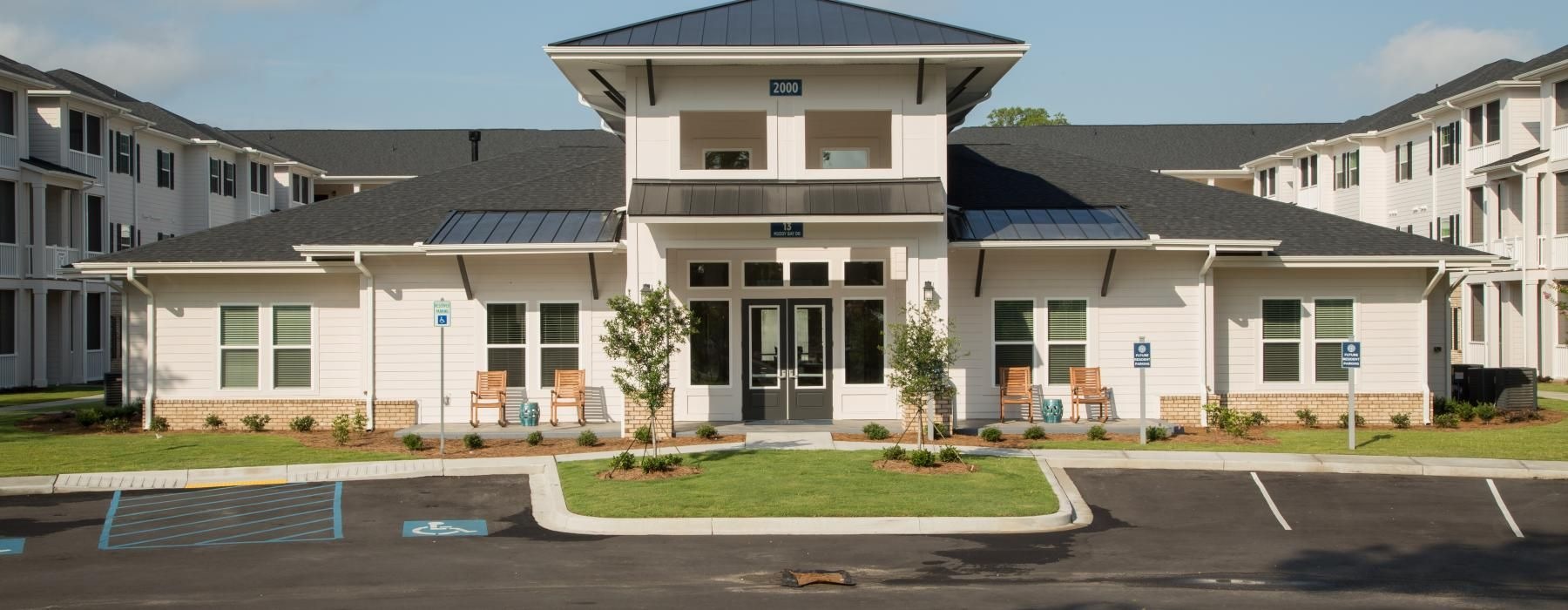 a large building with a parking lot